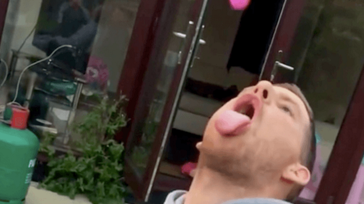 man catches dildo in mouth